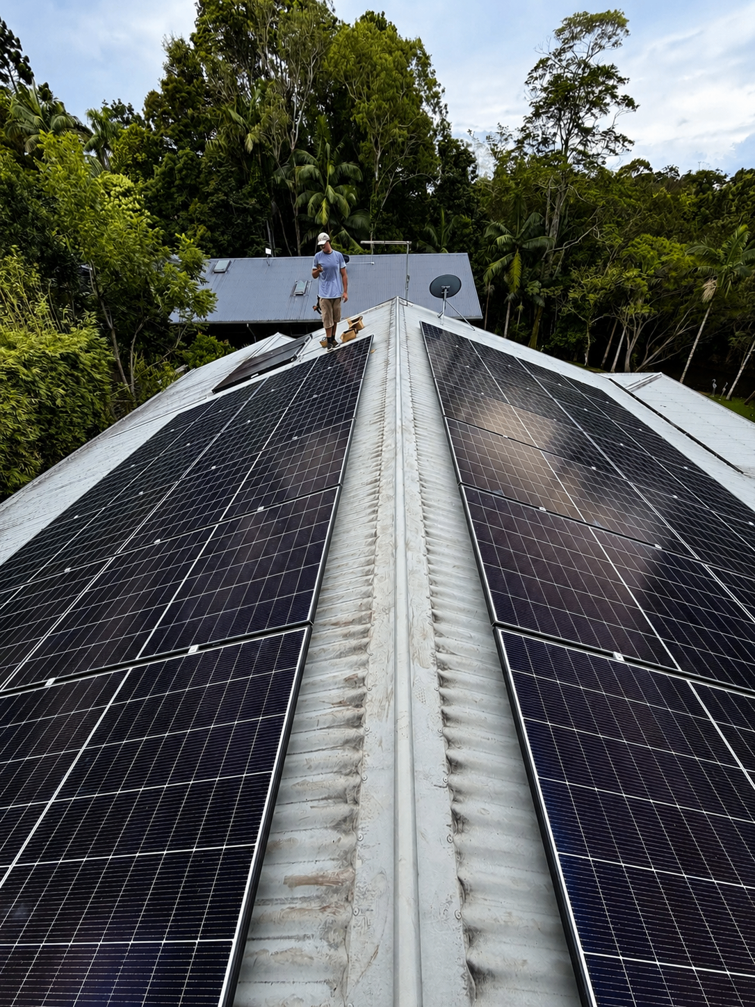 HJP installer with rooftop solar panels on a Northern Rivers home