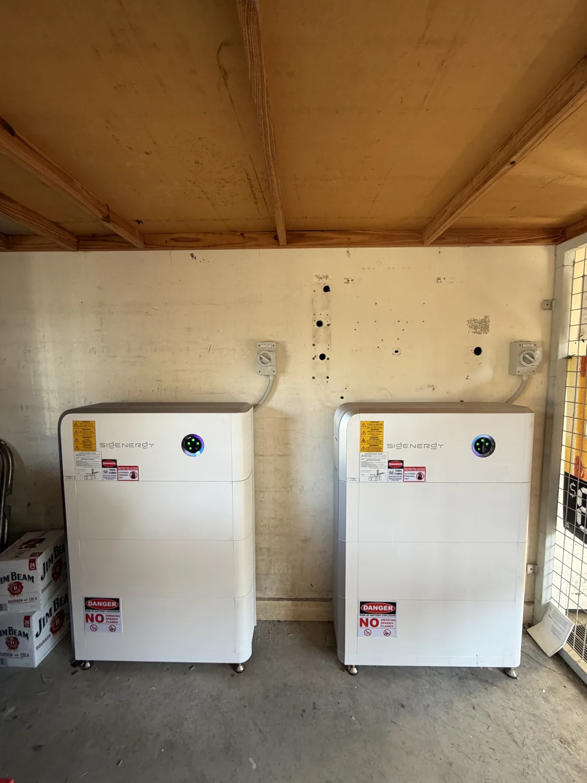 Two SigEnergy battery units installed in the hotel storeroom