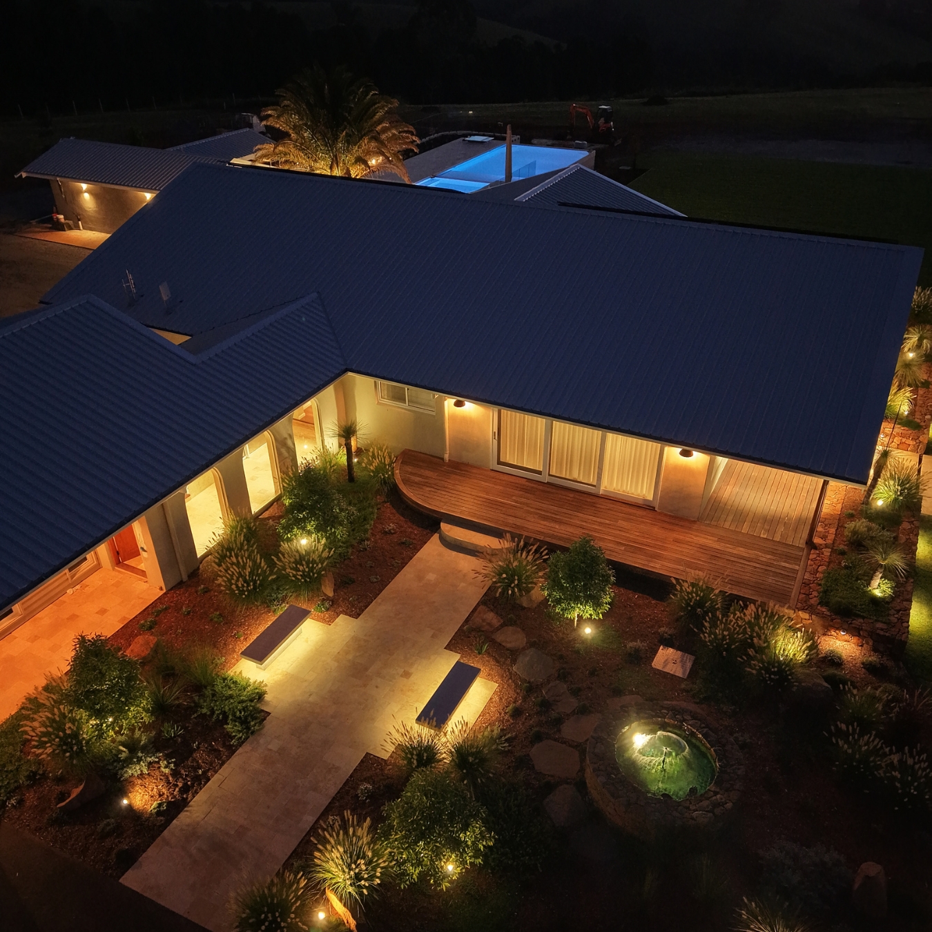 Northern Rivers home lit up at dusk, running on stored solar energy
